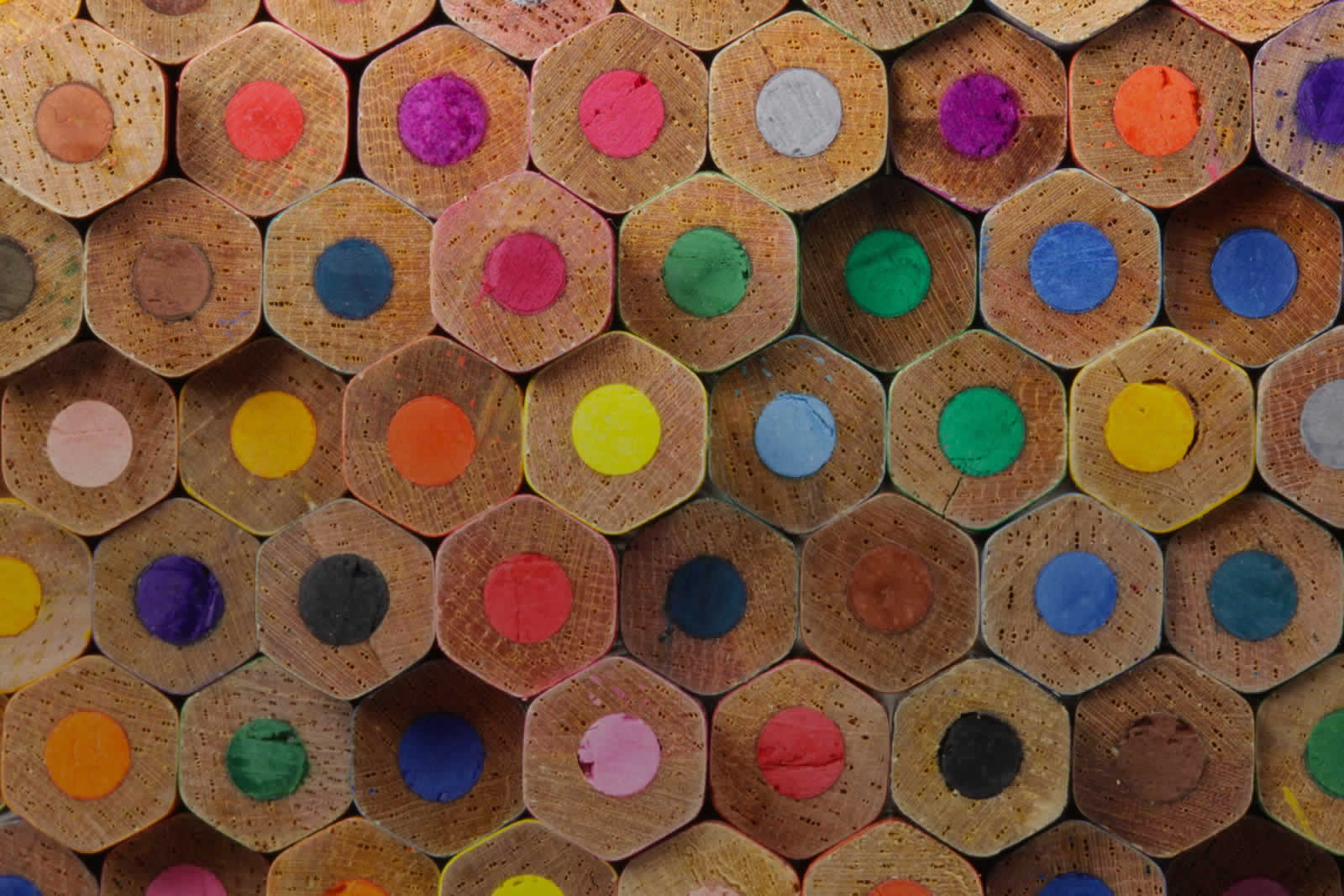 Colourful hexagonal crayons stacked up on top of each other