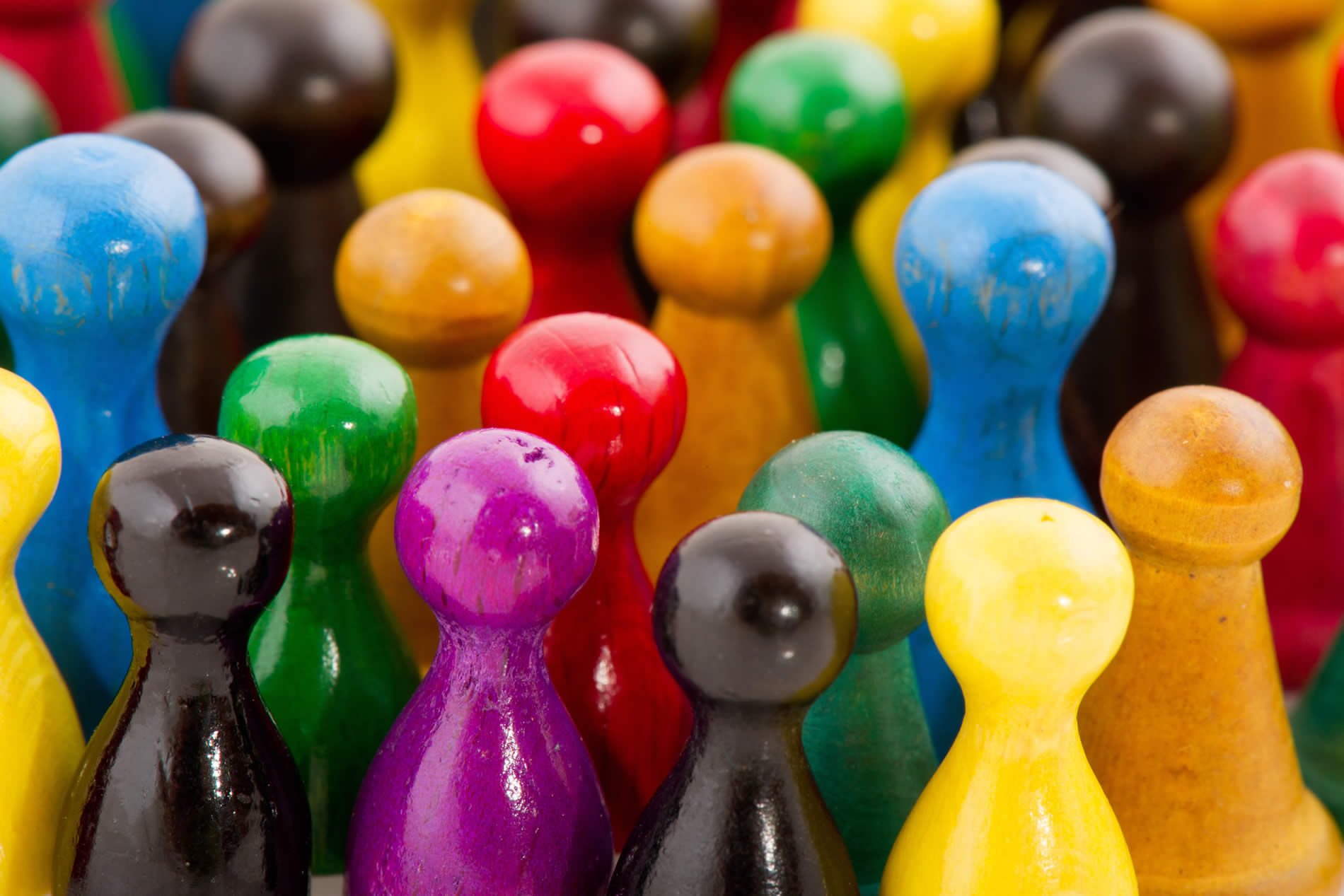 Close up of colourful wooden skittles representing market research participants
