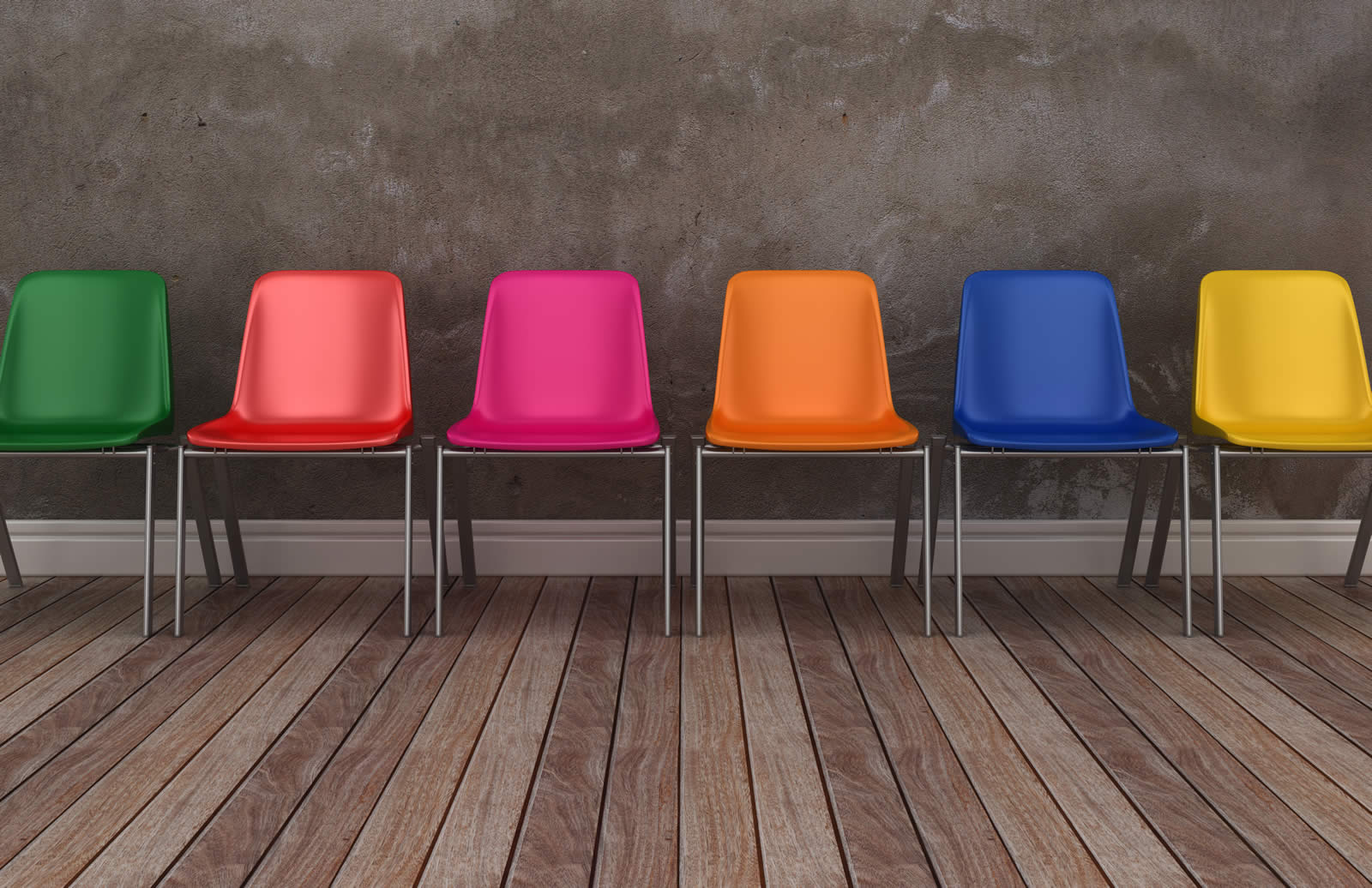 Colourful chairs lined up against a wall